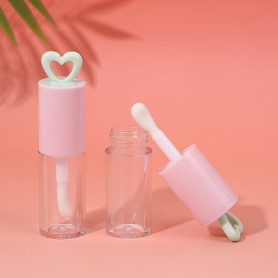 สีที่กําหนดเอง 7ml หัวใจโฮโล พลาสติก ท่อกระจกริมฝีปากสําหรับบรรจุกระจกริมฝีปากแบบพกพา