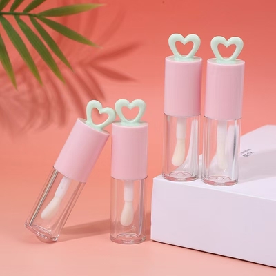 สีที่กําหนดเอง 7ml หัวใจโฮโล พลาสติก ท่อกระจกริมฝีปากสําหรับบรรจุกระจกริมฝีปากแบบพกพา
